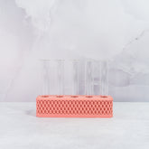 "Front view of empty CLAY RED Propagation Station, showing five clear tubes in a vibrant clay red block."